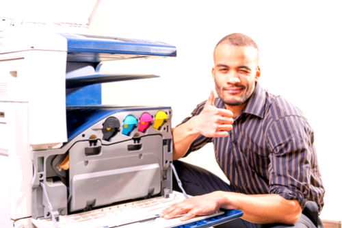 Man giving thumbs up after fixing printing